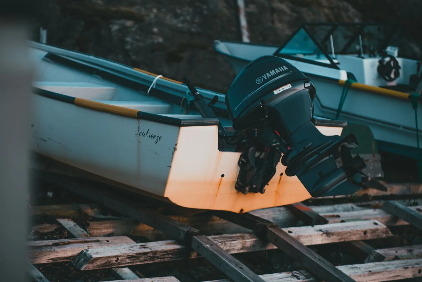 A boat with a Yamaha outboard on a trailer at a marine shop